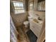 Bathroom with tile floors, tiled walls and updated fixtures at 2479 Landeau Cir, Tucker, GA 30084