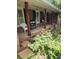 Charming front porch with brick and wood trim and black shutters at 2479 Landeau Cir, Tucker, GA 30084