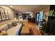 Inviting living room with hardwood floors, comfortable seating, and a cozy fireplace at 2479 Landeau Cir, Tucker, GA 30084