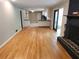 Spacious living room with hardwood floors, fireplace and access to the kitchen at 2479 Landeau Cir, Tucker, GA 30084