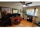 Functional office space with a desk, hardwood floors, and a ceiling fan at 2479 Landeau Cir, Tucker, GA 30084
