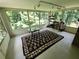 Bright sunroom with many windows offering verdant views at 2479 Landeau Cir, Tucker, GA 30084