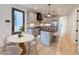 Bright, modern kitchen featuring stainless steel appliances, a large island, and a dining area with stylish chairs at 290 2Nd St, Fayetteville, GA 30214