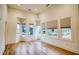 Living room features a bay window with lots of natural light and hardwood floors at 290 2Nd St, Fayetteville, GA 30214