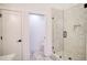 Bathroom featuring a tiled shower with glass door, neutral color palette, and modern fixtures at 290 2Nd St, Fayetteville, GA 30214