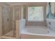 Spa-like bathroom with soaking tub and walk-in shower at 4505 Ajo Walk, Atlanta, GA 30331