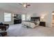 King-size bed in spacious main bedroom with two seating chairs at 4505 Ajo Walk, Atlanta, GA 30331