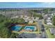 Community aerial view showcasing neighborhood amenities including tennis courts and pool at 120 Mill Creek Dr, Canton, GA 30115