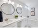 Bright bathroom featuring double sinks and a separate bathtub and a toilet at 120 Mill Creek Dr, Canton, GA 30115