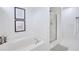 Bright bathroom featuring a bathtub and a glass door shower at 120 Mill Creek Dr, Canton, GA 30115