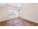 Bedroom with neutral walls, hardwood floors and two windows with white shutters at 120 Mill Creek Dr, Canton, GA 30115