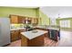 Well-lit kitchen featuring stainless steel appliances and wood cabinets at 120 Mill Creek Dr, Canton, GA 30115