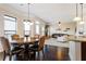 Charming dining room with round table and view of living room at 6280 Stillwood Ln, Cumming, GA 30041