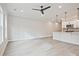 Open concept living room and kitchen with stainless steel appliances at 697 Sunstone Ln, Lawrenceville, GA 30043