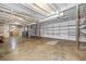 Unfinished basement showcases concrete floors, exposed pipes, and shelving at 1085 Azalea Cir, Marietta, GA 30062