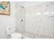 White bathroom with marble shower and tile floor at 2048 Chicago Nw Ave, Atlanta, GA 30314