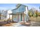 Two-story craftsman home with light green siding and a charming front porch at 2048 Chicago Nw Ave, Atlanta, GA 30314
