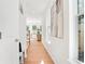 Light and airy hallway with hardwood floors and built-in storage at 2048 Chicago Nw Ave, Atlanta, GA 30314