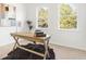 Bright home office with wooden desk and rug at 2048 Chicago Nw Ave, Atlanta, GA 30314