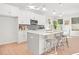 Modern kitchen with white cabinets, quartz countertops, and island at 2048 Chicago Nw Ave, Atlanta, GA 30314