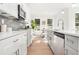 Bright kitchen featuring white cabinets and stainless steel appliances at 2048 Chicago Nw Ave, Atlanta, GA 30314