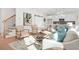 Open concept living room with hardwood floors, comfortable seating and kitchen view at 2048 Chicago Nw Ave, Atlanta, GA 30314