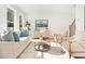 Spacious living room with hardwood floors, comfortable seating and large windows at 2048 Chicago Nw Ave, Atlanta, GA 30314