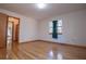 Bright bedroom featuring hardwood floors, window and neutral walls at 4771 Cool Springs Rd, Winston, GA 30187