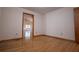 This bedroom features hardwood floors and an open doorway to another room at 4771 Cool Springs Rd, Winston, GA 30187