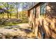 View of the home's exterior showcasing the driveway with a well-manicured lawn and lush landscaping at 4771 Cool Springs Rd, Winston, GA 30187