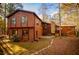 Beautiful brown two-story home with stone accents and lots of windows surrounded by colorful trees at 4771 Cool Springs Rd, Winston, GA 30187