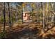 A house sits back from the road on a wooded lot at 4771 Cool Springs Rd, Winston, GA 30187