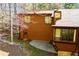 Charming view of the home's wood exterior with natural light and a glimpse of the tranquil backyard area at 4771 Cool Springs Rd, Winston, GA 30187
