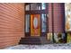 Inviting front entrance featuring a wood door with glass oval insert and stone accents, offering curb appeal and charm at 4771 Cool Springs Rd, Winston, GA 30187