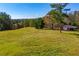 View of large lot with lush, green landscape and open land at 4771 Cool Springs Rd, Winston, GA 30187