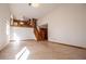 Open-concept living room with tile flooring and stairs leading to the second floor at 4771 Cool Springs Rd, Winston, GA 30187