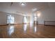 Large living room featuring track lighting, hardwood floors, and light-filled windows at 4771 Cool Springs Rd, Winston, GA 30187