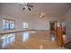 Bright living room with hardwood floors, ceiling fans and staircase at 4771 Cool Springs Rd, Winston, GA 30187
