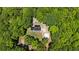 Aerial view of a secluded home surrounded by dense trees, offering privacy and tranquility at 291 Miquel Jorge Ln, Canton, GA 30115