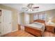 This bedroom boasts a ceiling fan and natural light at 291 Miquel Jorge Ln, Canton, GA 30115