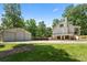 View of the home's exterior, garage, and backyard, showcasing its spacious layout and serene surroundings at 291 Miquel Jorge Ln, Canton, GA 30115