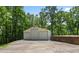 Large detached three-door garage, offering ample space for parking, storage, or a workshop area at 291 Miquel Jorge Ln, Canton, GA 30115