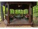 Cozy gazebo features comfortable seating and a tranquil view of the surrounding nature, creating a serene outdoor retreat at 291 Miquel Jorge Ln, Canton, GA 30115
