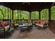 Inviting gazebo featuring wicker furniture and rustic details nestled amongst lush greenery and offering serene outdoor relaxation at 291 Miquel Jorge Ln, Canton, GA 30115