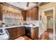 Country kitchen features custom wood cabinets, granite countertops, stainless appliances, and a breakfast nook at 291 Miquel Jorge Ln, Canton, GA 30115