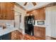 Kitchen with custom wood cabinets, granite countertops, stainless appliances, and wood floors at 291 Miquel Jorge Ln, Canton, GA 30115