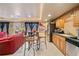 Kitchenette with a breakfast bar, stainless steel fridge, and wood cabinets at 291 Miquel Jorge Ln, Canton, GA 30115
