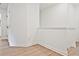 Upstairs hallway with neutral walls and flooring at 717 Trevett Way, Marietta, GA 30062