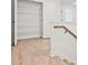 Upstairs hallway with linen closet and neutral flooring at 717 Trevett Way, Marietta, GA 30062