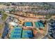 Aerial view of community tennis courts, pool, and surrounding neighborhood at 905 Fairview Club Cir, Dacula, GA 30019